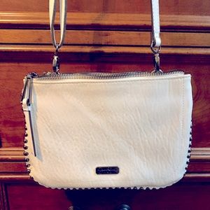 Jessica Simpson white leather crossbody handbag with leopard interior.